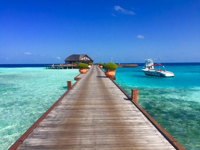 Maldives pier in blue waters