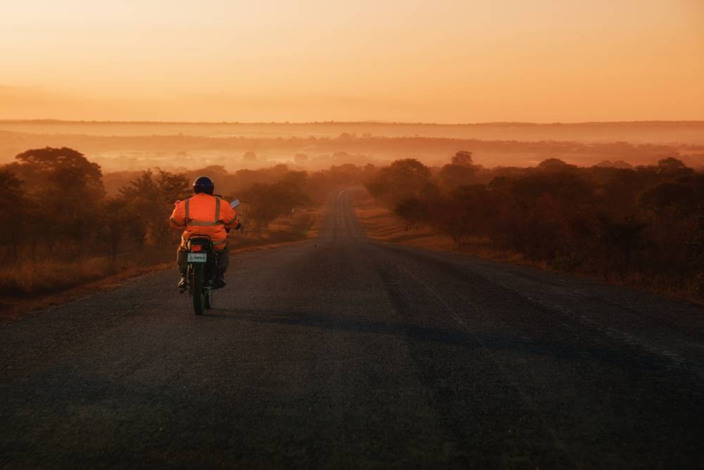 A biker on the Great East Road in Zambia, early in the morning.
