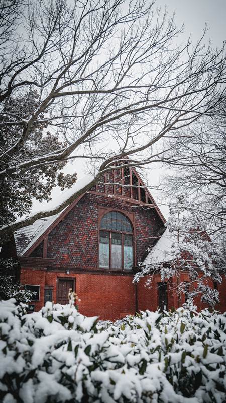 University church with stained glass covered in fresh snowfall in Washington D.C.