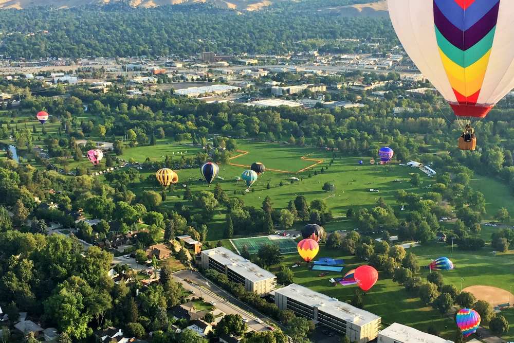 Hot air balloons landing throughout Ann Morrison park during the Spirit of Boise hot air balloon rally.